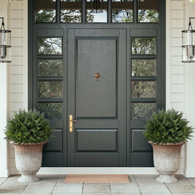 LUWENER cedar topiary at the outdoor front door adds year-round greenery.