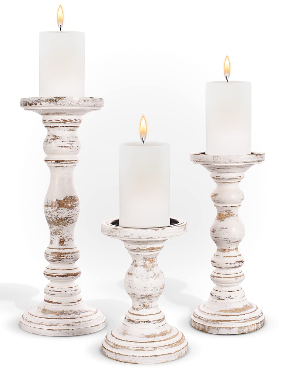 Luxe Designs pillar candle holders 3pc white create a warm table centerpiece.