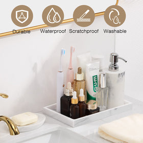 Luxspire resin jewelry dish holds rings and necklaces neatly on the counter.