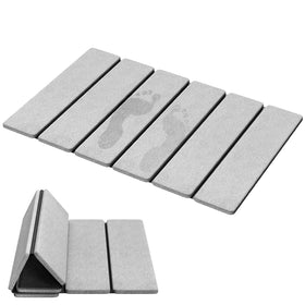 Luxspire stone bath mat folded for compact storage, roll-ready design.