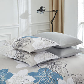 Luxudecor bedroom styling with blue floral ensemble creates a serene retreat.