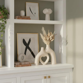 Lvases Snuggle Heart Vase Milky White side view reveals hollow heart design.