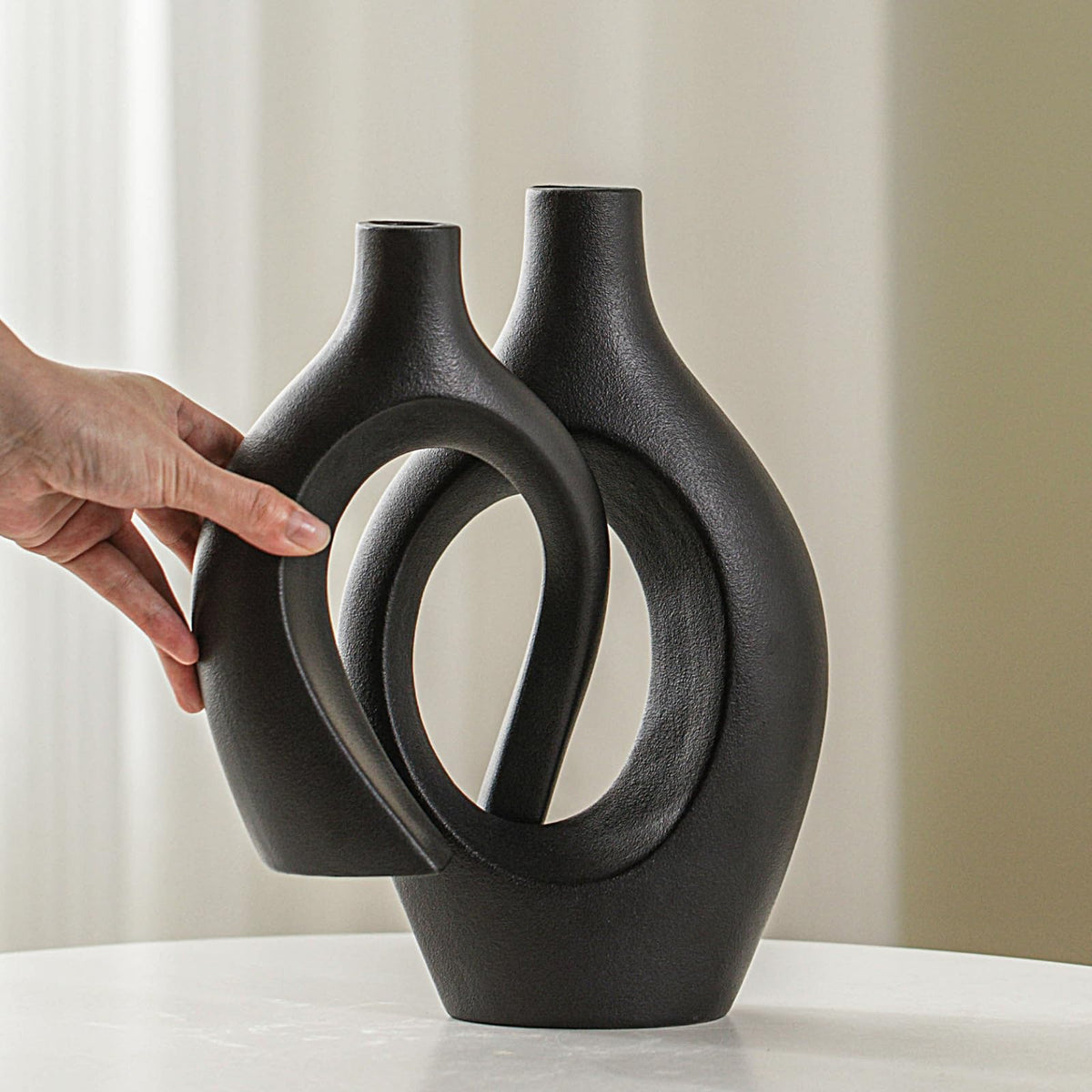 Lvases Snuggle Hollow table arrangement with both vases styled together.