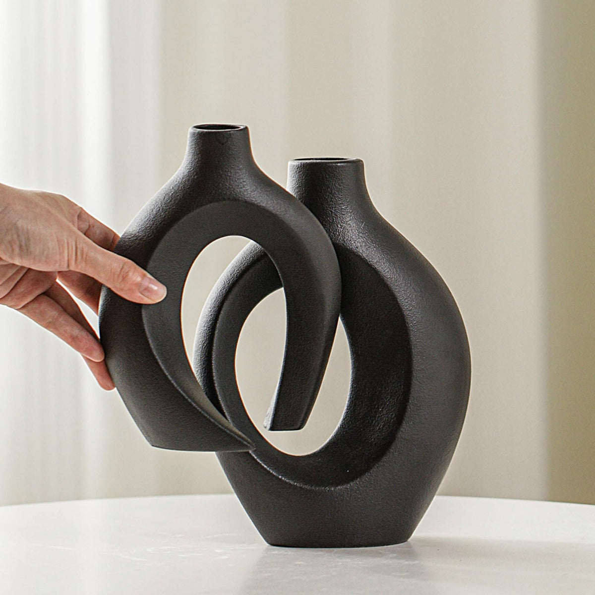 Lvases Snuggle Hollow short vase ideal for compact bouquets and pampas.