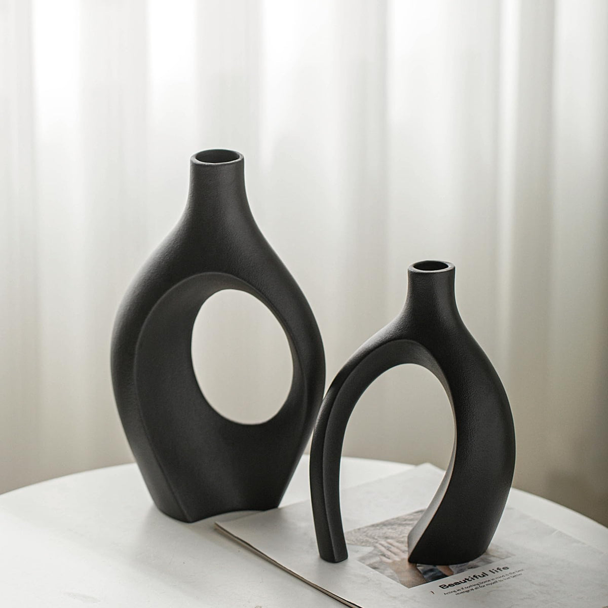 Lvases Snuggle Hollow short vase highlights compact height for desktop floral displays.