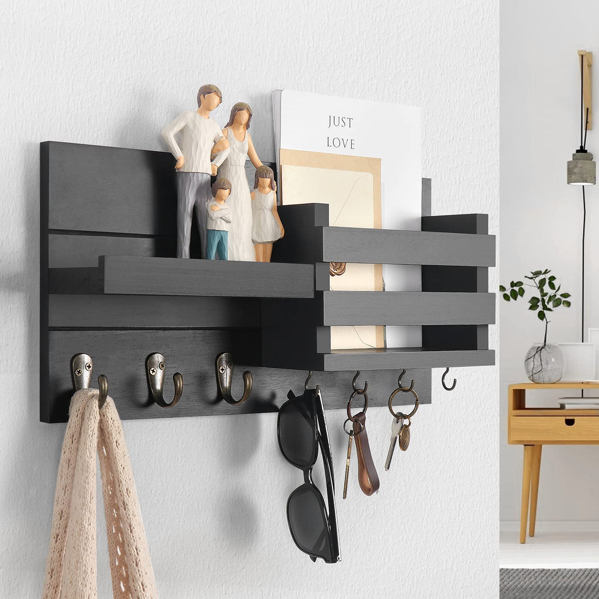 Lwenki entryway organizer hooks hold coats and bags.