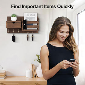 Lwenki key organizer includes a drawer for small items and trinkets.