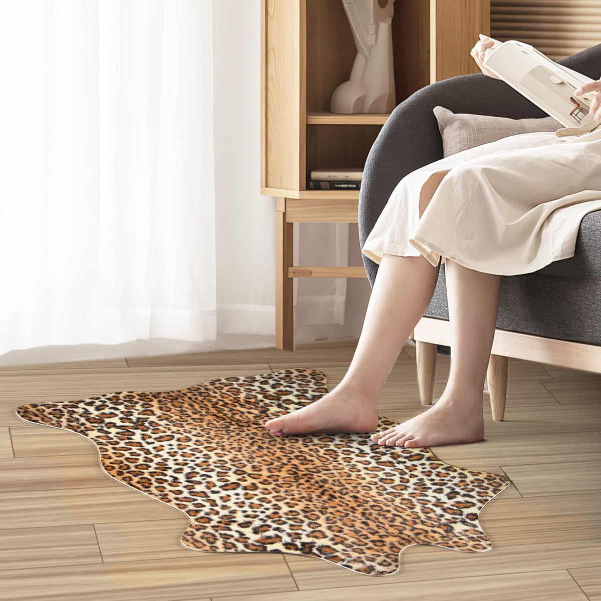 MACEVIA Leopard Rug features non-slip backing to stay in place on smooth floors.