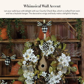 MACKENZIE-CHILDS bee wall art in black and white enhances kitchens and bathrooms.