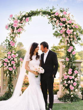 MACTING pink foam rose used in a wedding bouquet setup