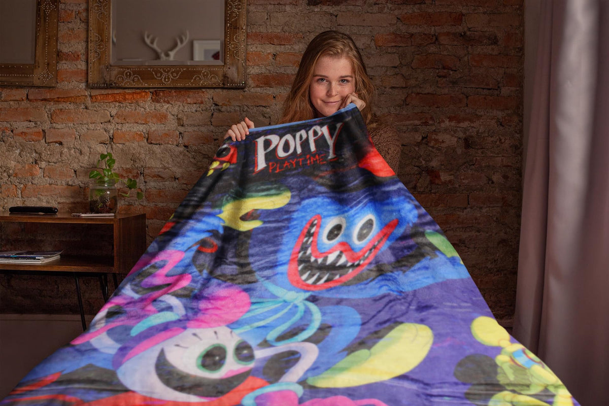 Mad Engine Poppy Playtime Huggy blanket laid flat for cozy couch décor