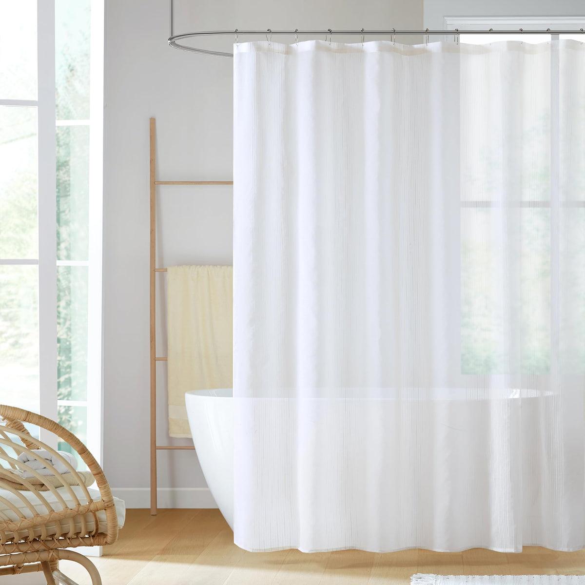 Madison Park Anna sheer shower curtain in ivory adds airy privacy.