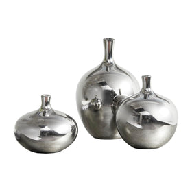 Madison Park Ansen ceramic vase with silver metallic finish illuminates shelves.
