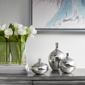 Madison Park Ansen vases in varied shapes create balanced displays.