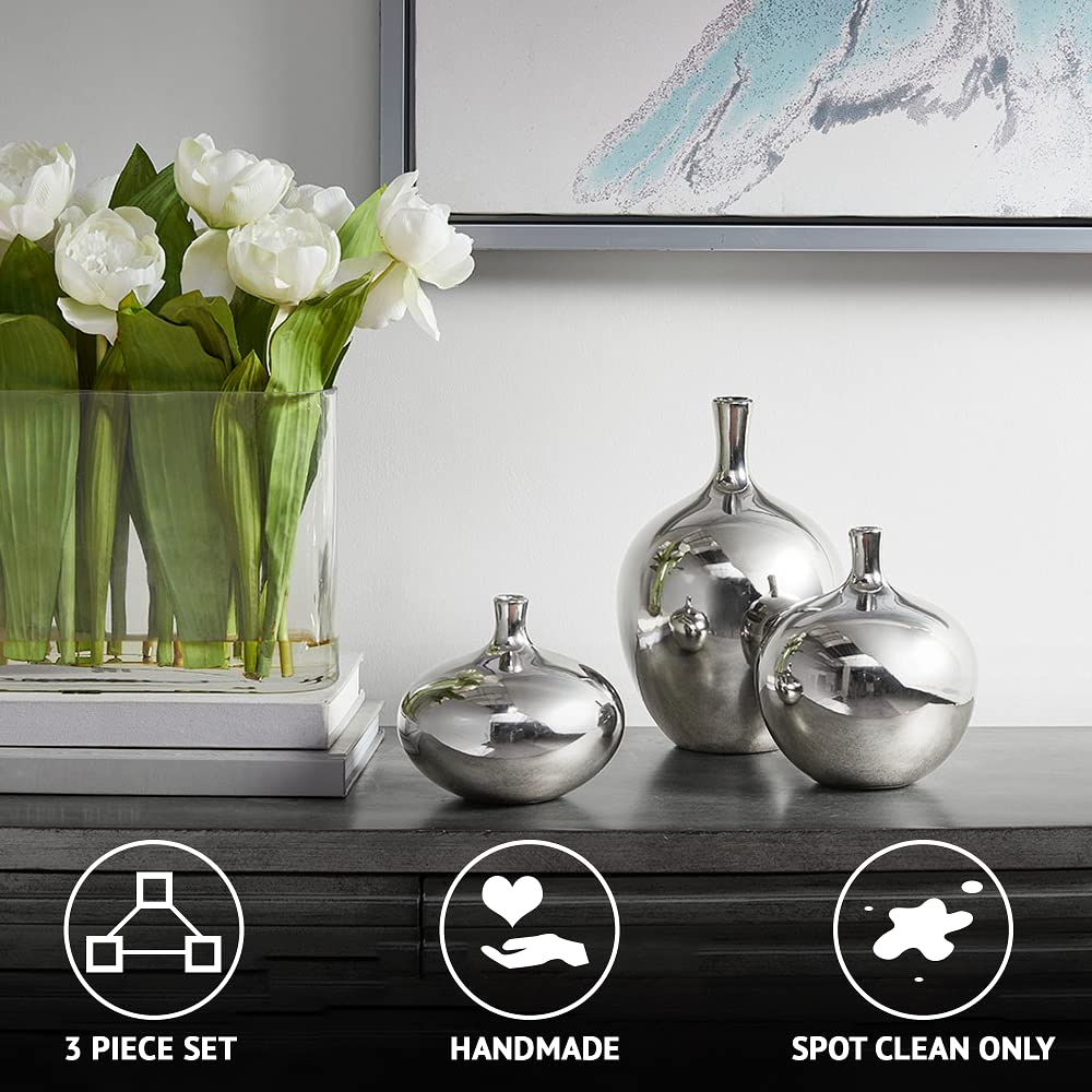 Madison Park Ansen metallic vases reflect light for subtle ambience.