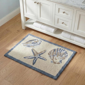 Cotton tufted Bayside rug complements towels and shower decor.