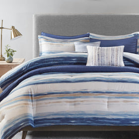 Madison Park Marina comforter seersucker texture with watercolor blue stripes for a serene look.