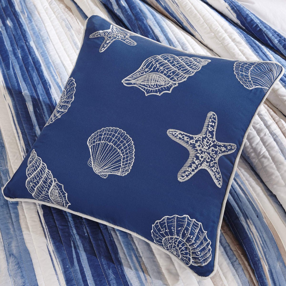 Madison Park Marina pillow with seashell details enhances beach-inspired decor