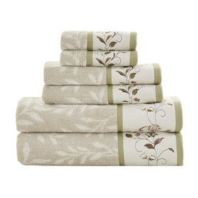 Madison Park Serene towel set with jacquard leaf pattern enhances bath decor.