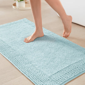 Madison Park Splendor bath rug with tufted top for dense plush softness.