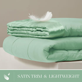 Madison Park Windom satin trim close-up highlights silky touch and refined finish