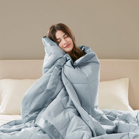 Madison Park Windom blue twin blanket spread on bed for all-season style