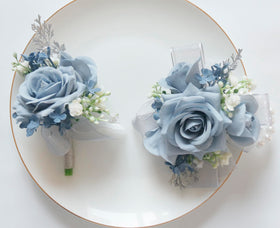 MAFELOE greenery and ribbon accents enhance boutonniere styling.