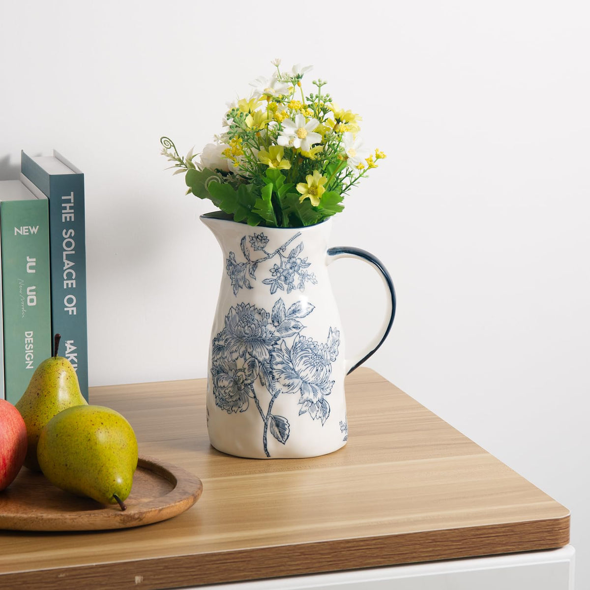 Magclay artisan ceramic pitcher serves as a versatile centerpiece and flower vase.