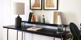 Main and Mesa marble geometric bookends with wood inlay on shelf highlight natural marble variations for unique decor