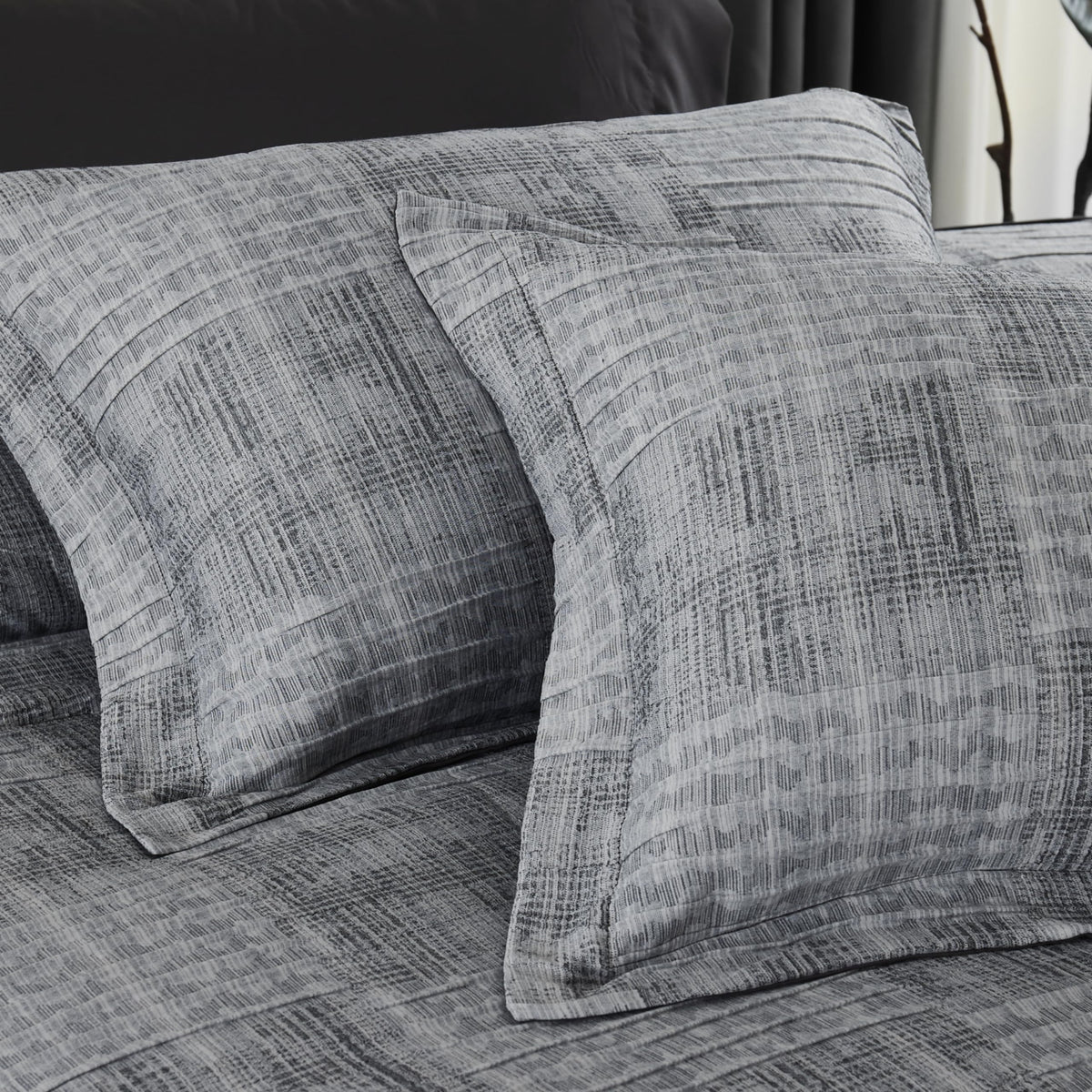 MaiRêve Charcoal Grey shams complete the coordinated bed-in-a-bag look.