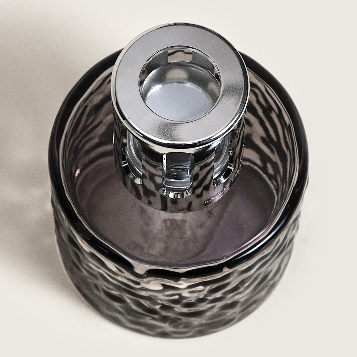 Mirage lamp cap removal shown for easy refill and continuous scent.
