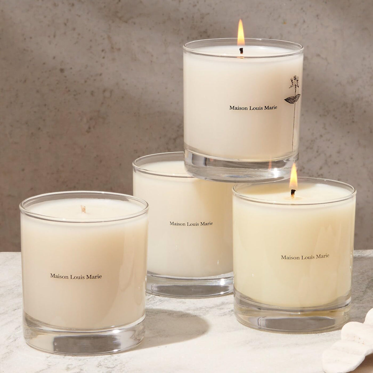 Maison Louis Marie No.04 Bois de Balincourt wax pool glows softly for cozy evenings.