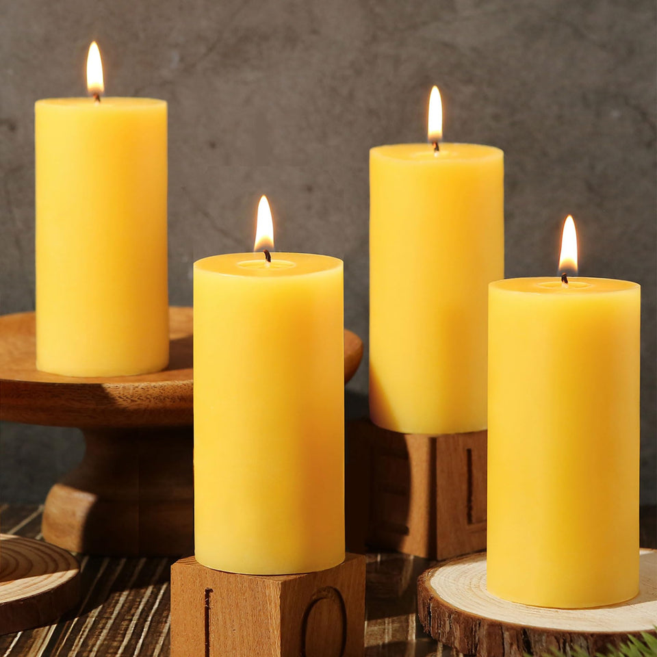 MAKALONE 2x4in beeswax pillar candles on table for a warm centerpiece.