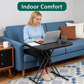 MAKE CHANGES folding table on couch used as TV tray and snack setup.