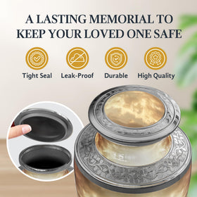 Malaika Memorials cross urn aluminum body shown on an elegant surface