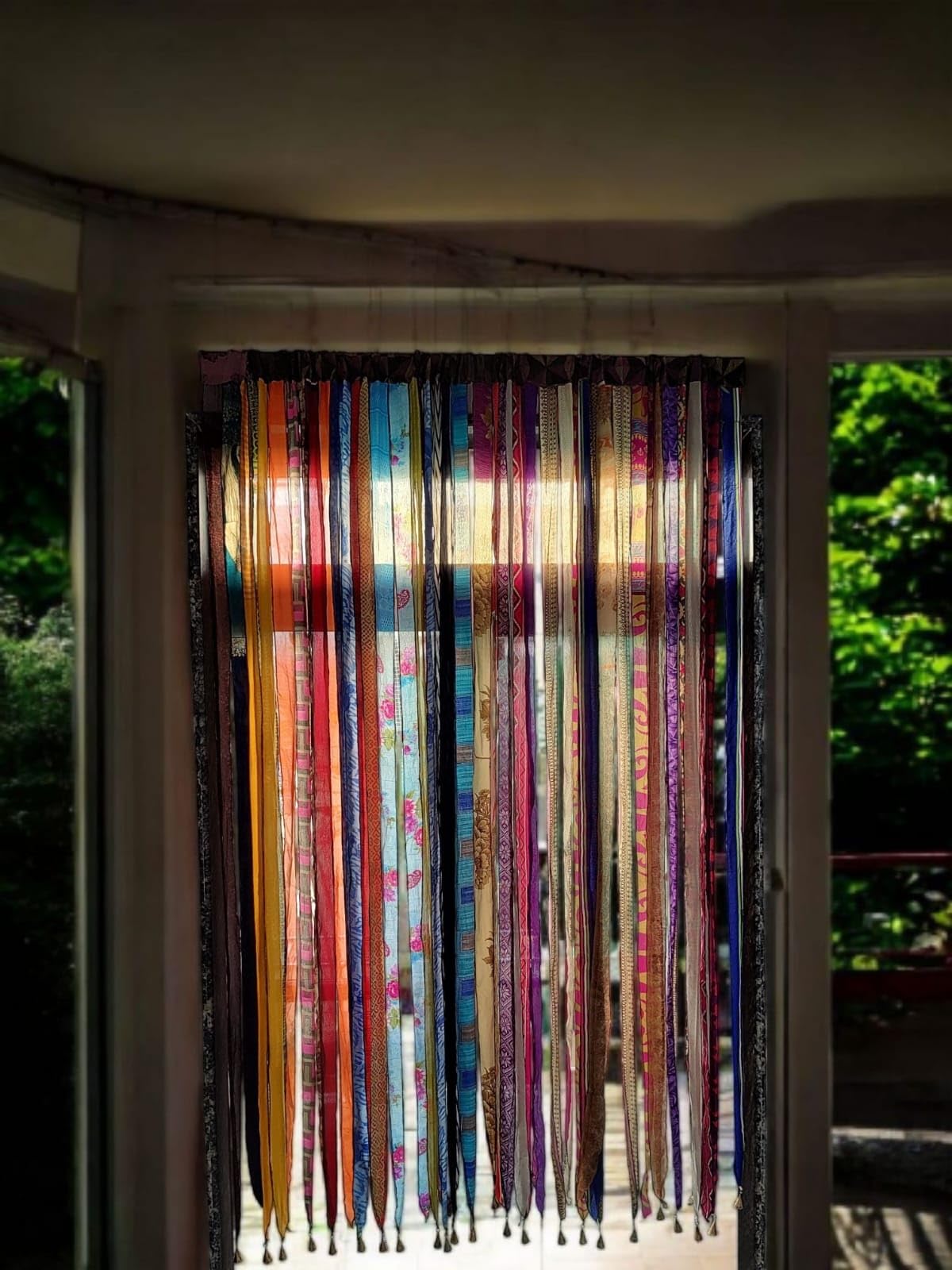 Mango Gifts boho ribbon curtain bells bottom enhances ambience with gentle tinkling.