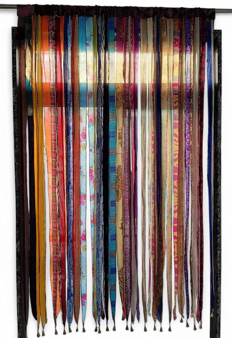 Mango Gifts old silk sari ribbon curtain doorway adds boho charm and light filtration.