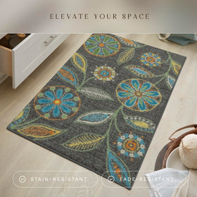Maples Rugs Reggie floral rug close-up displays vibrant hues against charcoal background for lively rooms