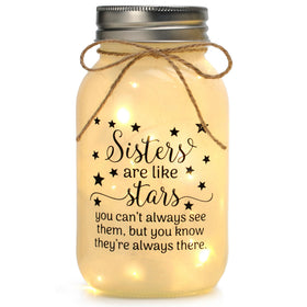 Maracco mason-jar-night-light with warm light on a desk adds cozy ambiance