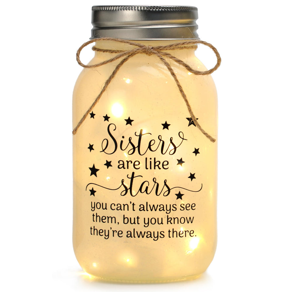 Maracco mason-jar-night-light with warm light on a desk adds cozy ambiance