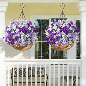 MARTINE MALL colorful faux flowers in planters brighten entryways.