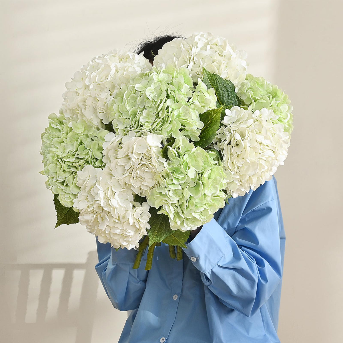 Martine Mall office accents with white hydrangea for sophisticated ambiance.