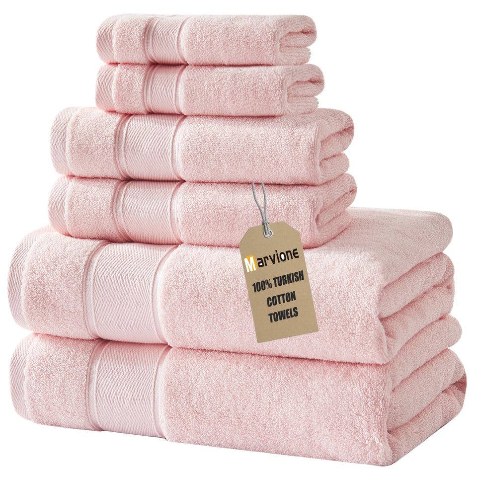 Marvione 6-piece pink bath towel set displayed on rack, plush and inviting for daily bathroom use.