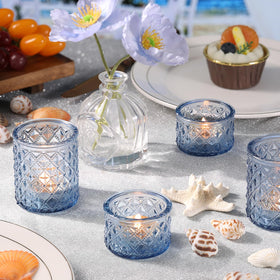 MATAHUM blue votives create coastal vibes for beach-themed receptions.