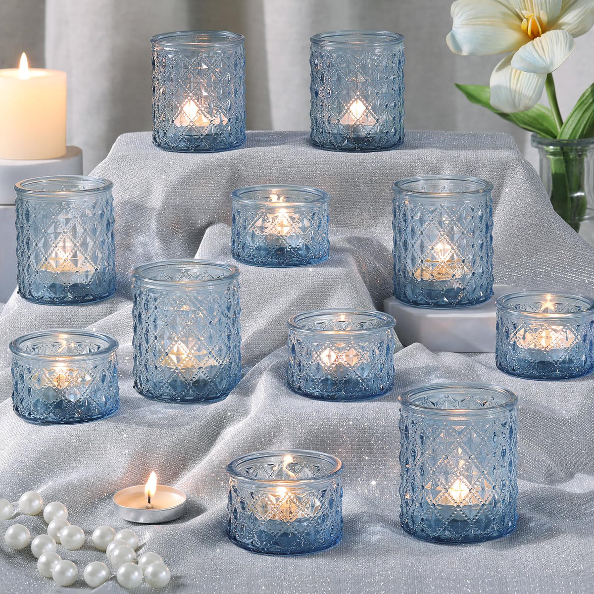 MATAHUM blue tealight holders with diamond design reflect light to elevate table decor.
