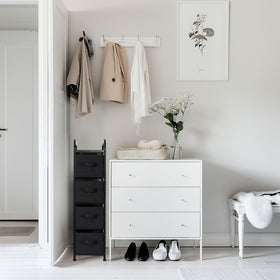 MAX Houser fabric storage tower in a bedroom for clutter control.