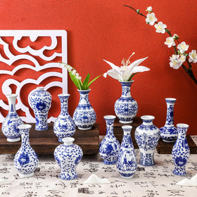 Maxcheck blue and white bud vase 12-pack for coordinated home or office decor.