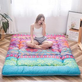 Foldable floor mattress in living room setup for flexible seating
