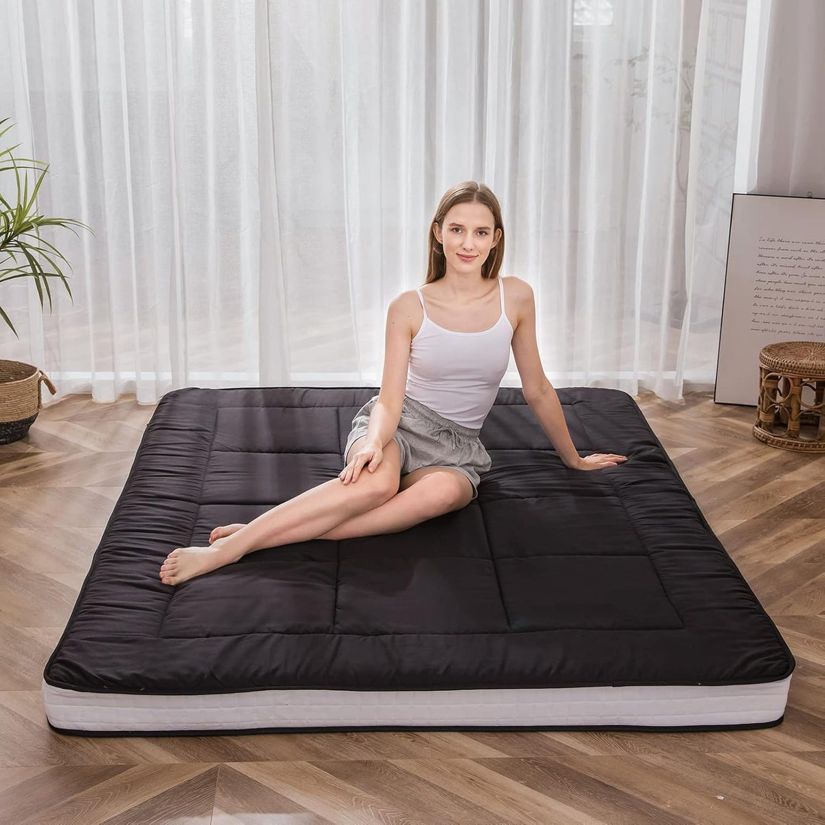 MAXYOYO Futon Mattress folded for storage demonstrates lightweight versatility for travel.