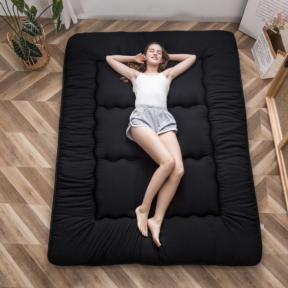 MAXYOYO Japanese floor mattress folded for compact storage and travel convenience.